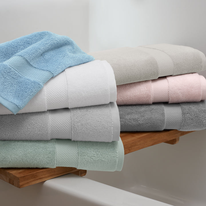 A stack of plush Egyptian Cotton Bath Towels in serene spa colors.
